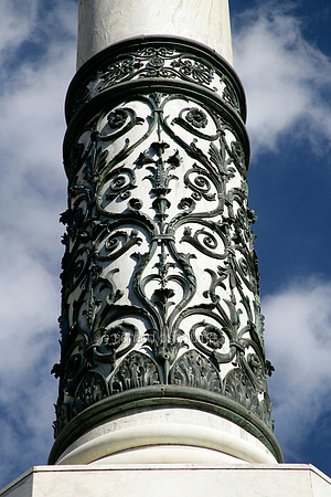 V5AR24  Bronze Sculpted Detail Around Roman Column, Rome, Italy